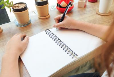 Woman writing in journal