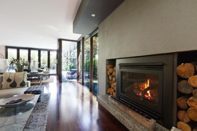 contemporary living room with log fire heater